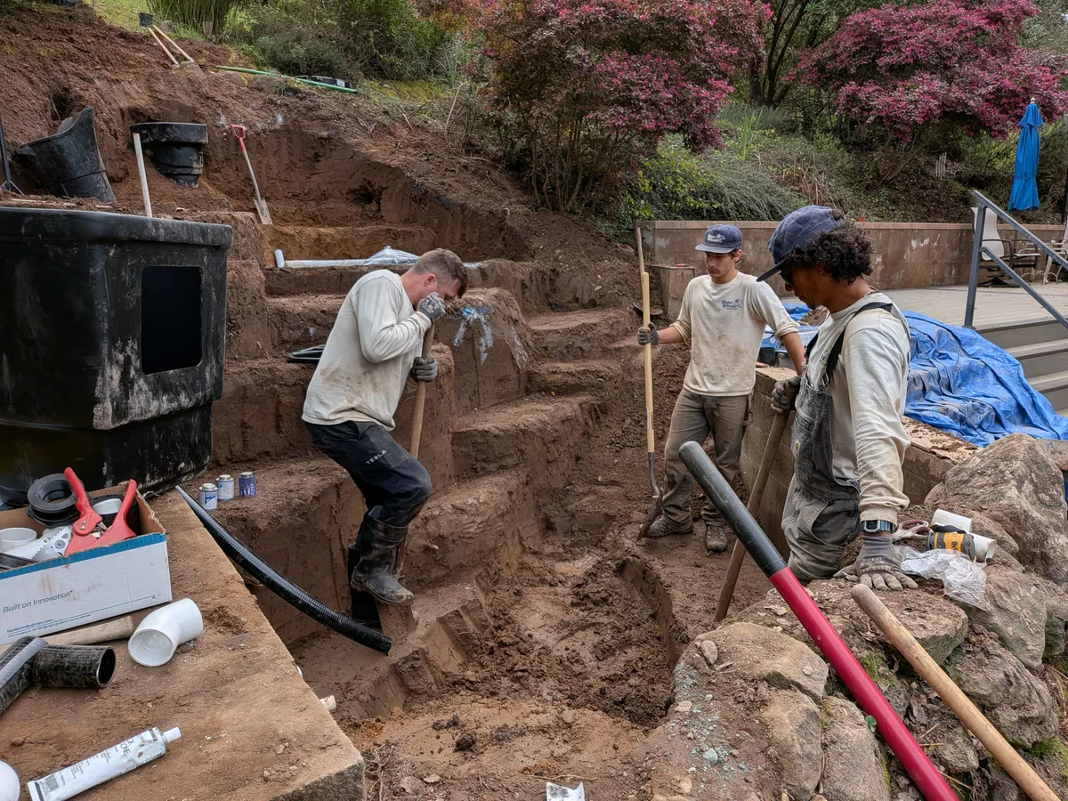 The Water & Stone crew building an ecosystem pond together